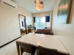 The Alcoves 1-bedroom condo dining and living area with modern furnishings in Cebu City