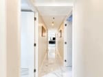 Marble-floor hallway leading to the living area of a 3-bedroom corner condo at Marco Polo Residences, Cebu City