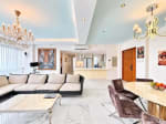 Living room with sectional sofa, marble coffee table and tiger artwork overlooking the open kitchen, Cebu City condo