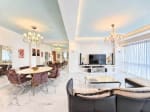 Furnished living and dining room with TV, crystal chandelier and sheer-curtained windows, Marco Polo Residences