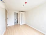 Unfurnished bedroom with built-in white wardrobe in a 2-bedroom loft condo at Mandani Bay Tower 2