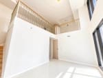 Loft partition and staircase highlighting the vertical layout of a 104 sqm Mandani Bay Tower 2 condominium