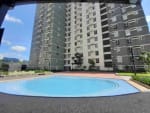 Outdoor swimming pool surrounded by high-rise condominium buildings at Avida Riala Tower 3, Cebu IT Park, Cebu City.