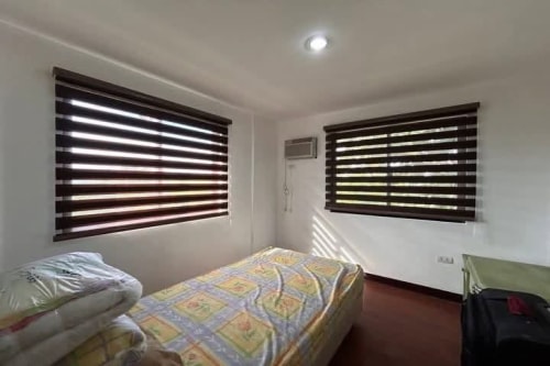 Bed with two windows in House & Lot for Sale in Liloan, Cebu