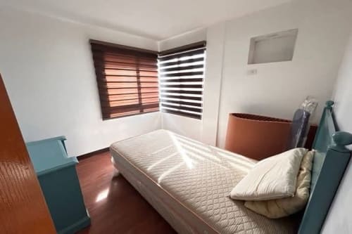 Bedroom view with white bed and two windows in House & Lot for Sale in Liloan, Cebu