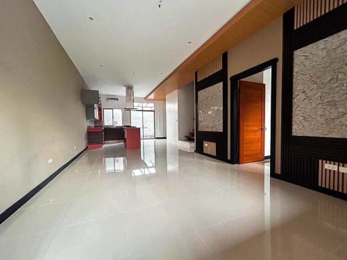 Spacious living room with kitchen in luxury 4-bedroom townhouse in Apas Cebu City