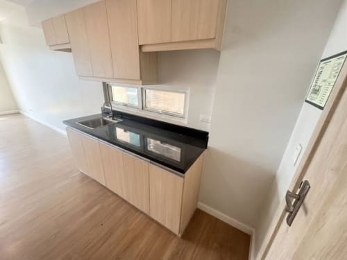 Studio condo kitchen with built-in cabinets at Solinea Tower 4 Cebu City