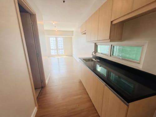 Studio condo entrance with kitchen and bathroom at Solinea Tower 4 Cebu Business Park