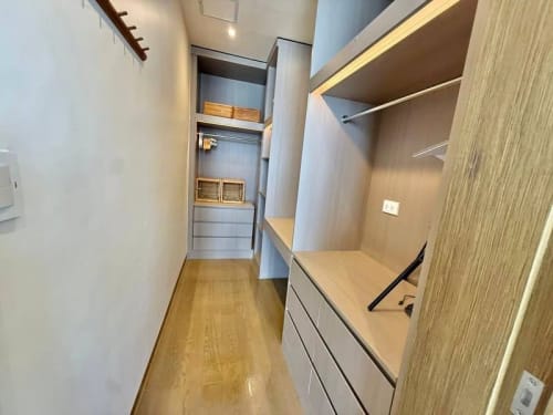 Built-in wardrobe and closet storage in a fully furnished one-bedroom sea-view condo for sale in Punta Engaño, Mactan, Cebu.