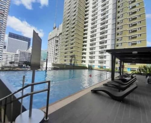 Swimming pool and high-rise residential buildings at Avida Riala Tower 3 condominium in Cebu IT Park, Cebu City.