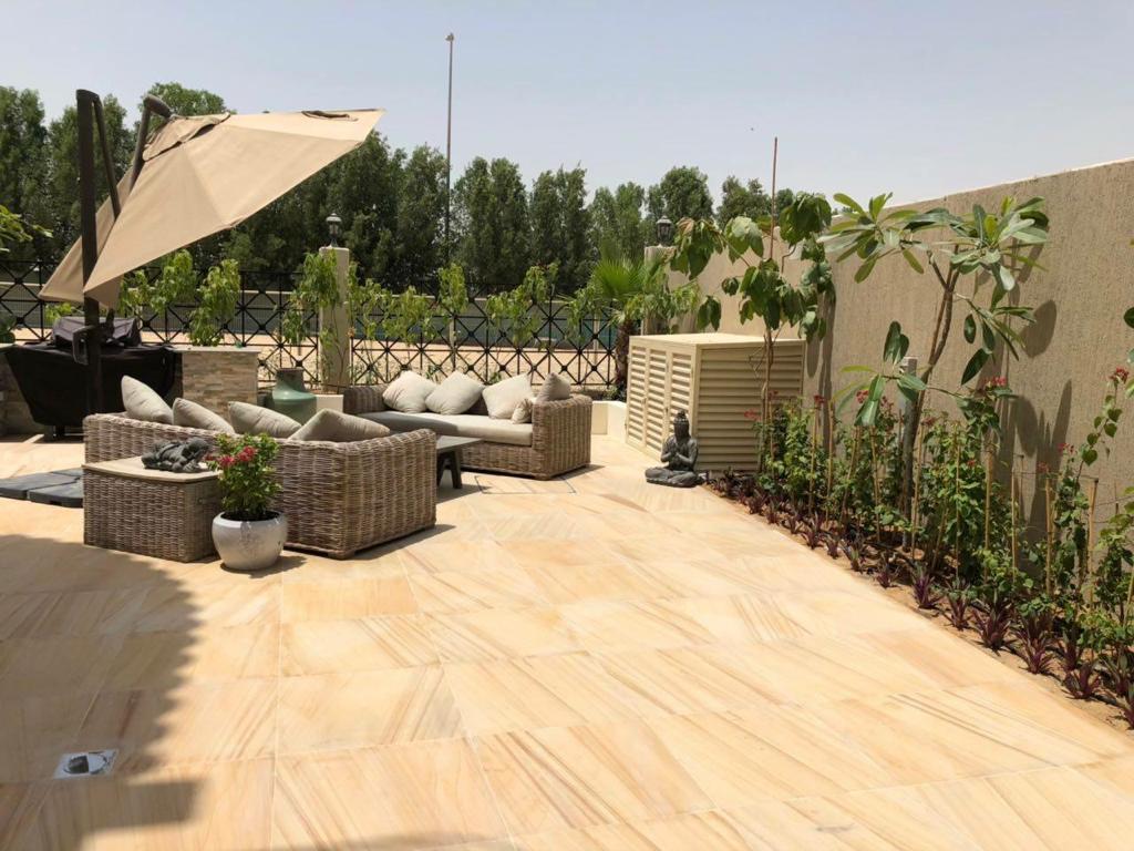 Villa landscape construction project in Living Legends Dubai with planters, plantation, and seating areas - Photo 8