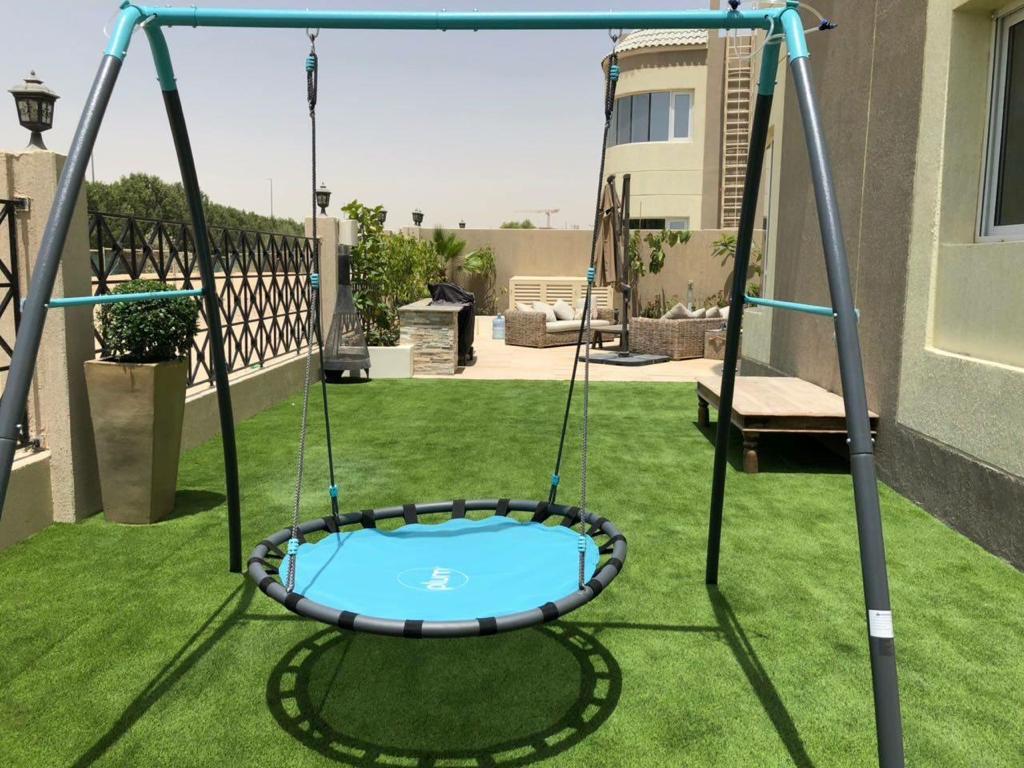 Villa landscape construction project in Living Legends Dubai with planters, plantation, and seating areas - Photo 5