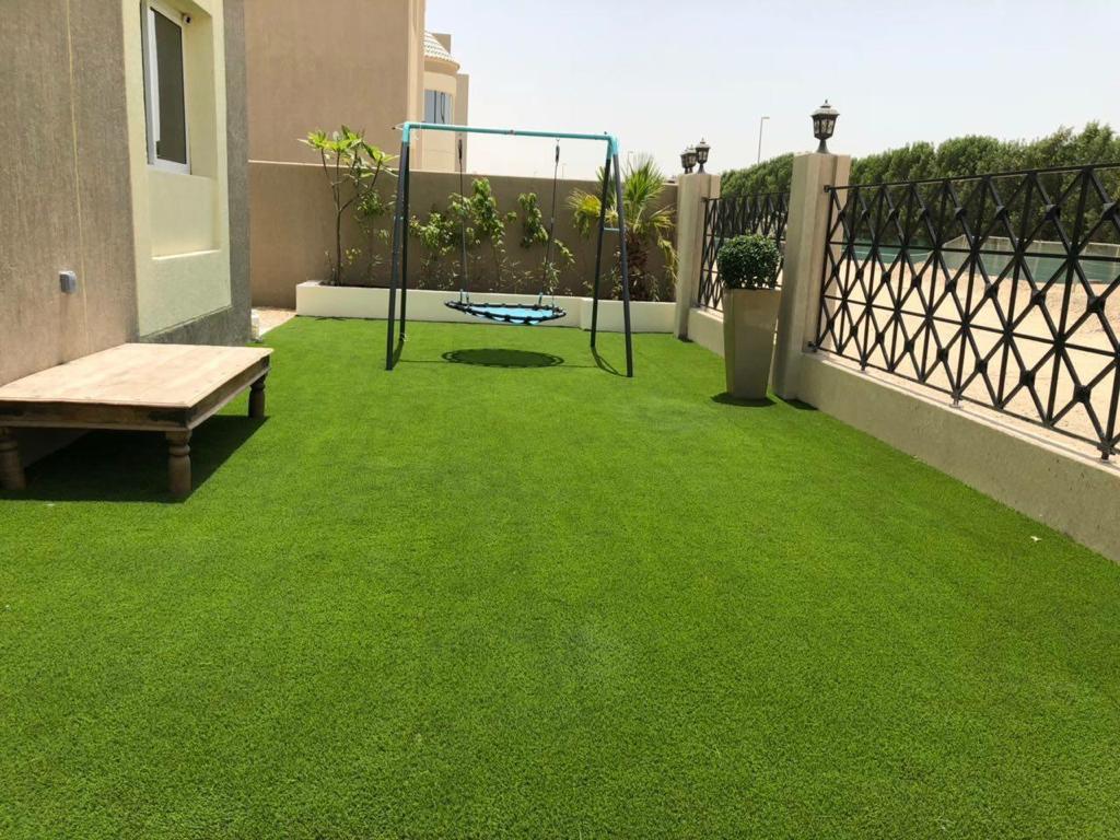 Villa landscape construction project in Living Legends Dubai with planters, plantation, and seating areas - Photo 4