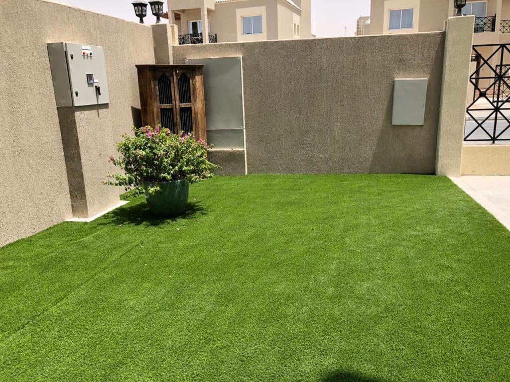 Villa landscape construction project in Living Legends Dubai with planters, plantation, and seating areas - Photo 3