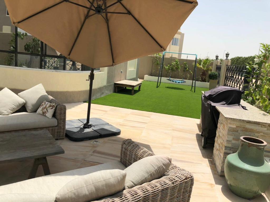 Villa landscape construction project in Living Legends Dubai with planters, plantation, and seating areas - Photo 2