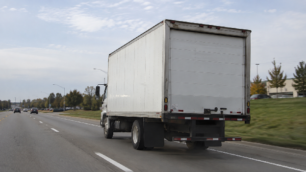 White delivery truck on the road during daily box truck business operations