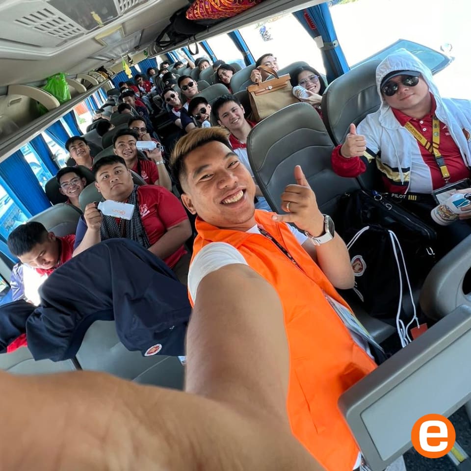 Etours tour guide and guests inside the tour bus