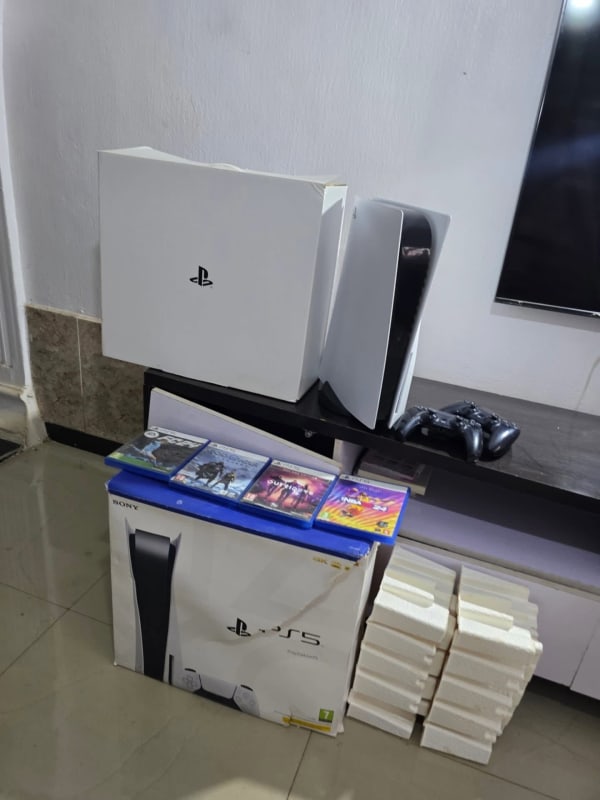 PS5 with 2 Pads, 4 Different CD Games