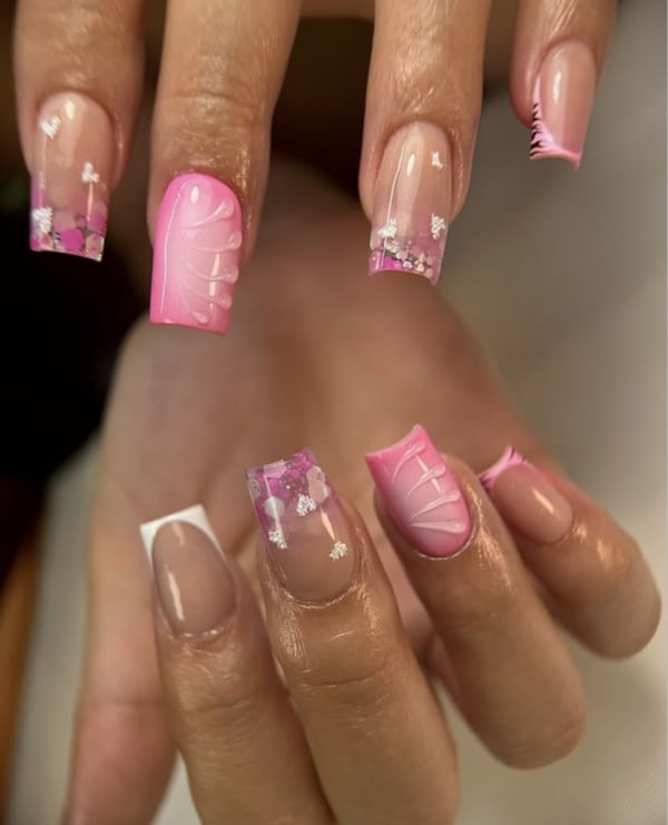 Short, acrylic nails with tips.