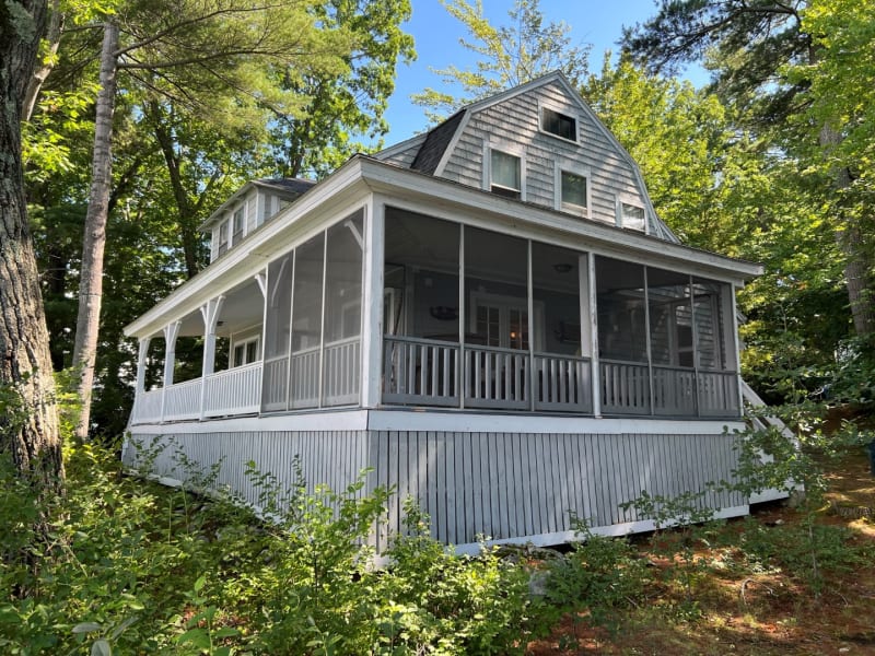 Classic Lake Winnipesaukee cottage at sunrise