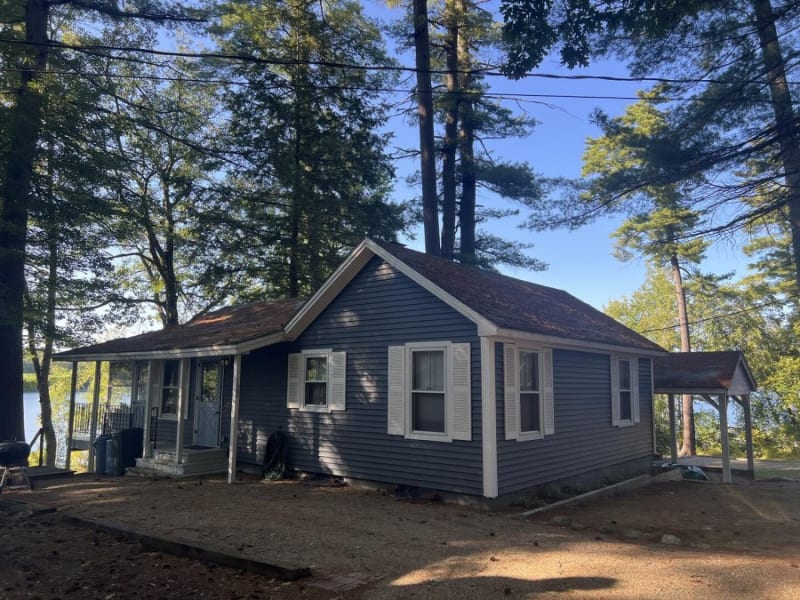 Sunset view from lakefront cottage dock with peaceful water