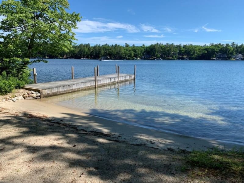 Private sandy beach and dock on Winter Harbor