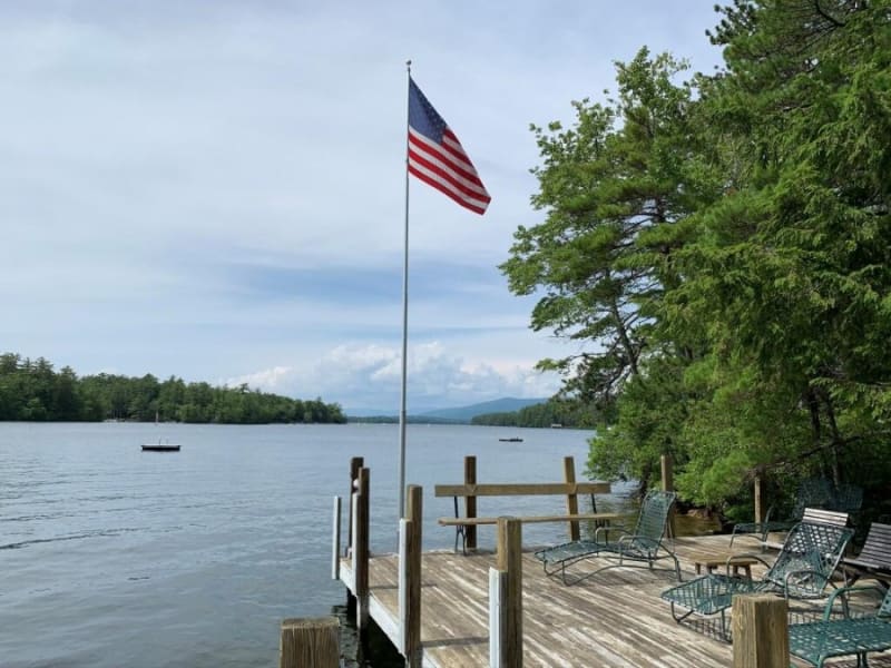 Sandy beach with deep water dock and panoramic lake views