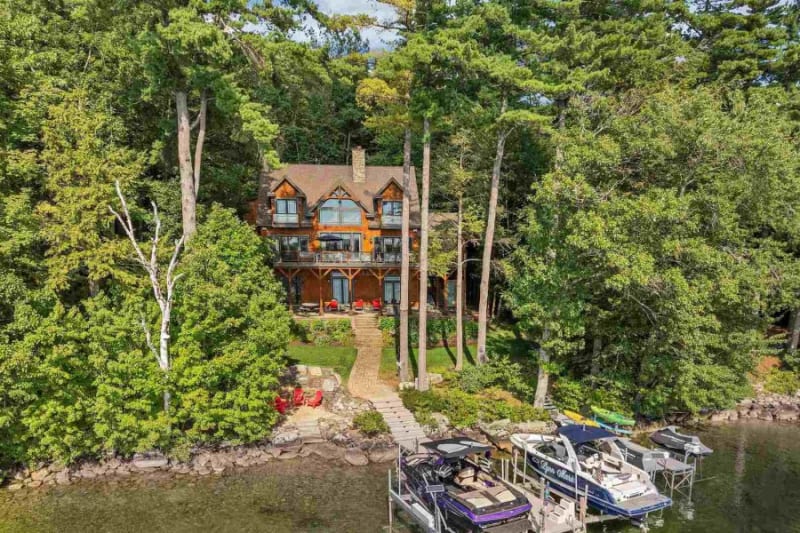 Stunning lakefront exterior with expansive deck