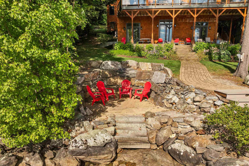 Private sandy beach with dock and lake views