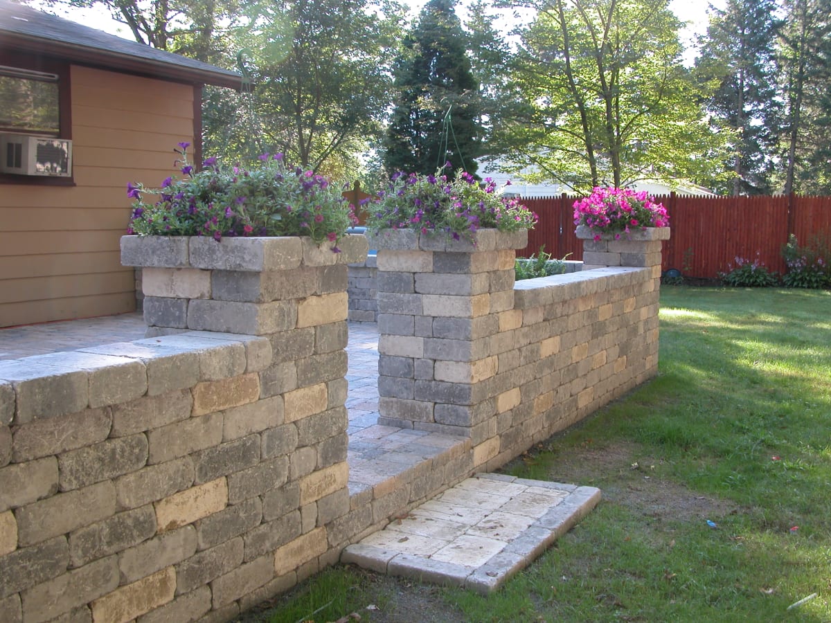 Stone wall with planters built by Burns Landscaping