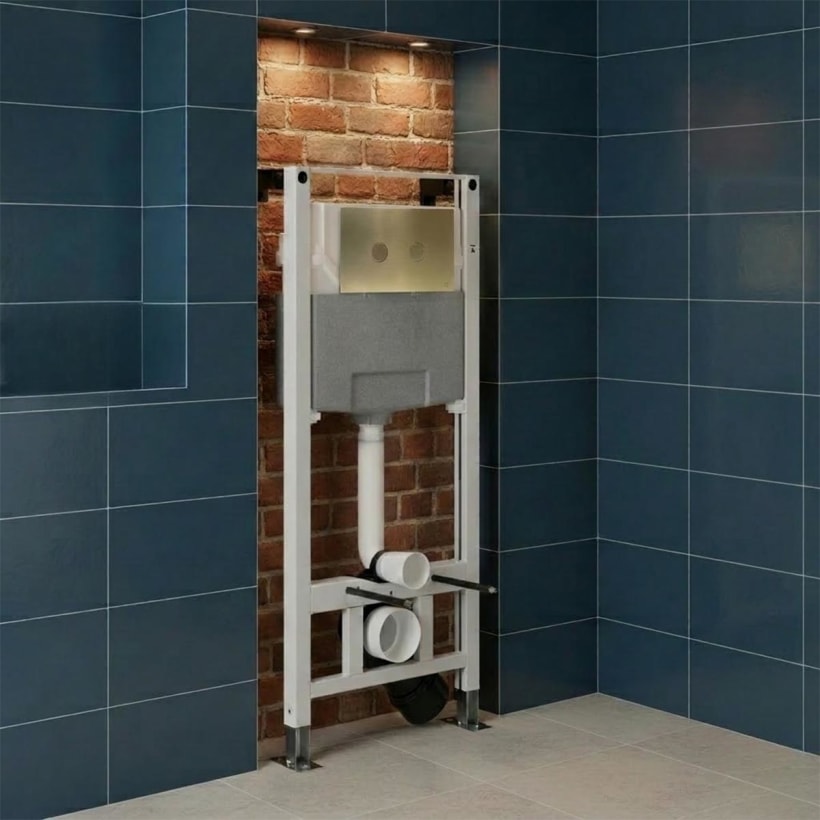 Concealed cistern toilet frame and brushed brass flush plate
