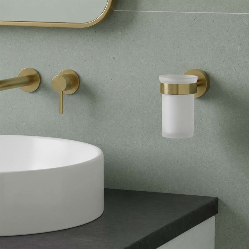 brushed brass holder with glass tumbler