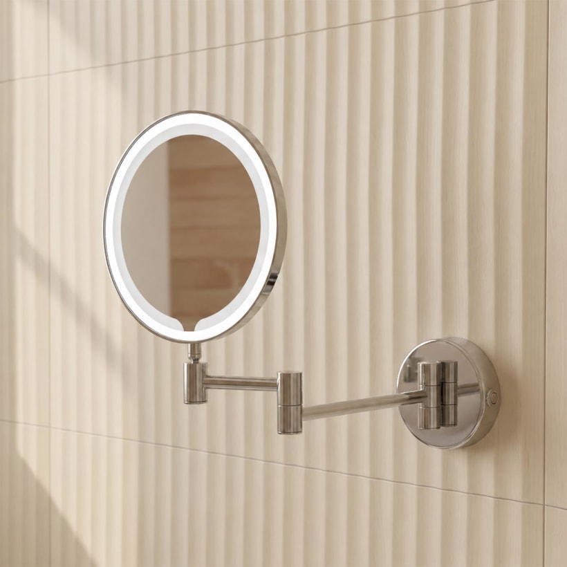 Illuminated magnifying mirror with sensor
