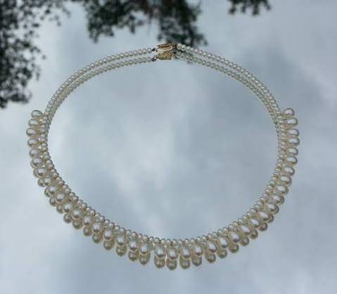 Elegant Double Strand Pearl Necklace with Teardrop Pearl Design