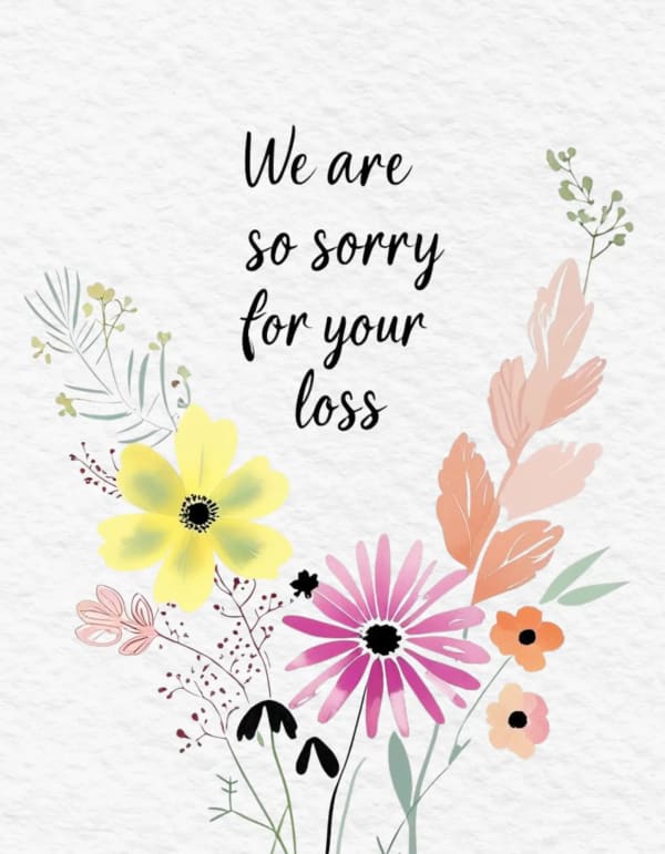 A sympathy card with a delicate floral design in soft pastel hues.