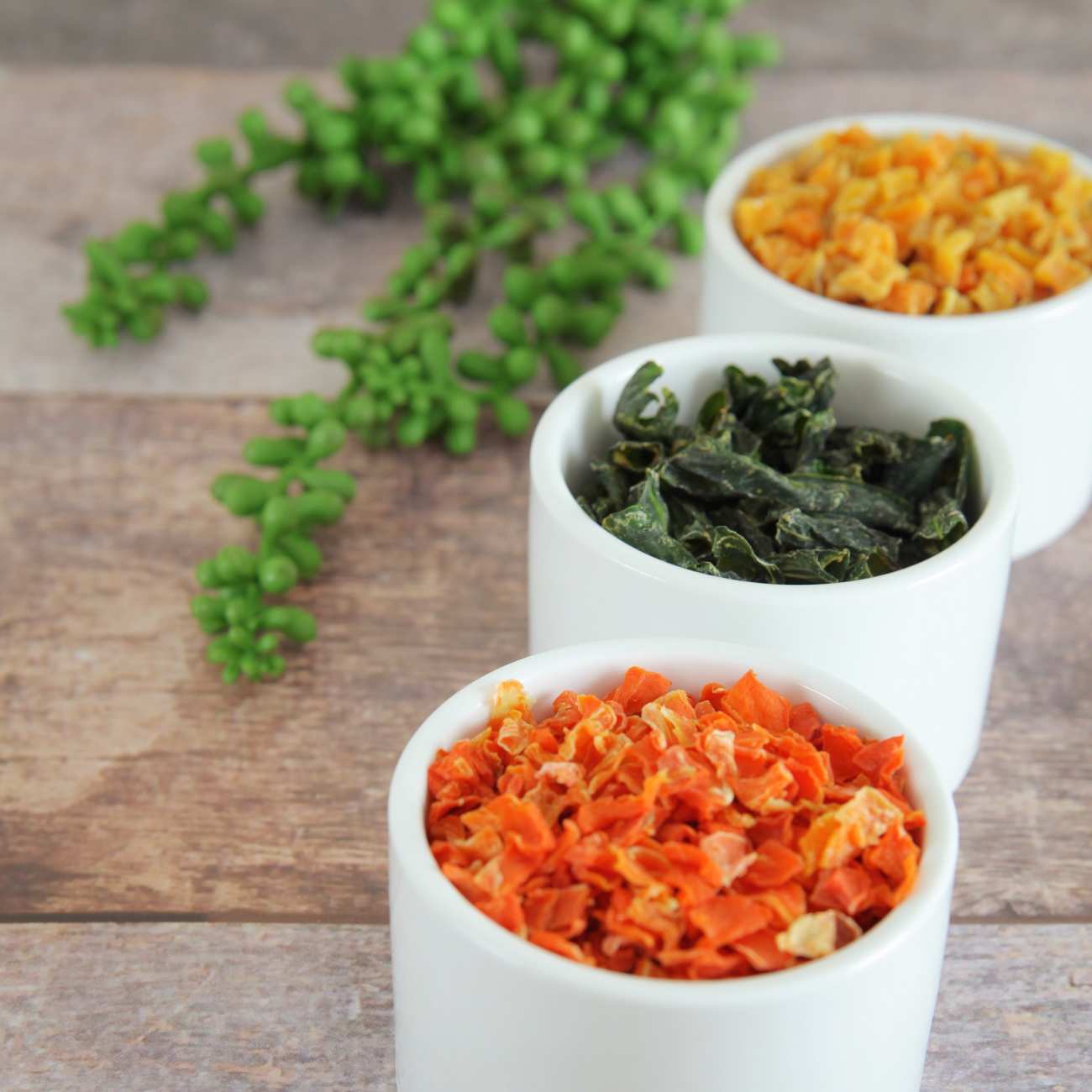 A group of white bowls with food in them