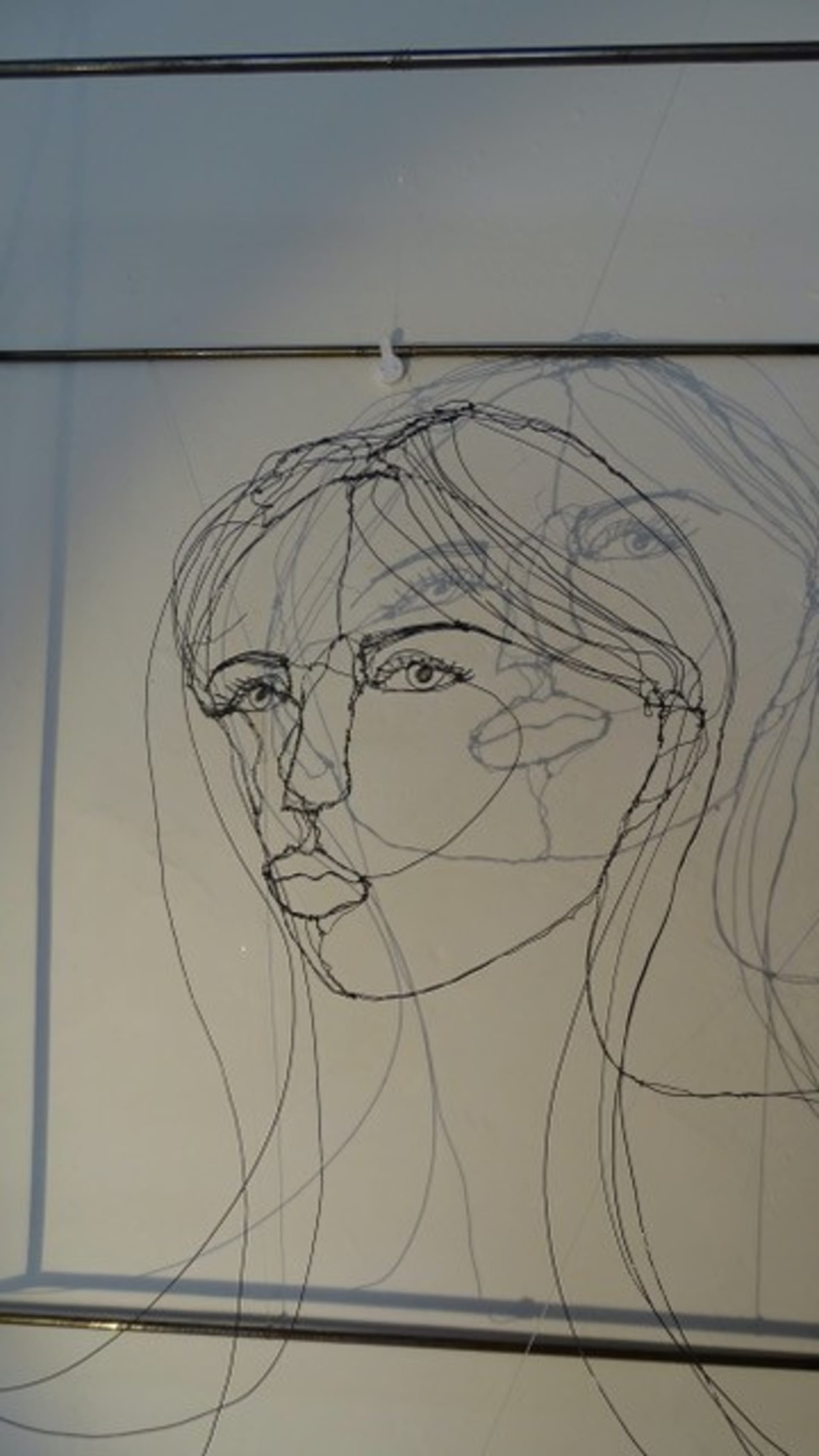 Étude de visage 2025.23, vue 3, sculpture en fil de fer par Myriam Louvel
