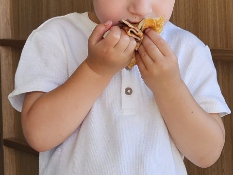 A child eating a crepe