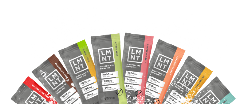 Eight LMNT electrolyte packets arranged in an arc, each with different colored accents showing various flavors