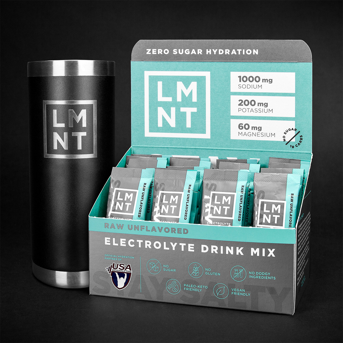 Hand selecting a LMNT electrolyte packet from a retail box containing only Grapefruit packets