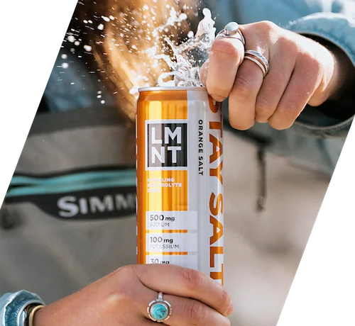 12oz orange can being opened and the drink exploding out