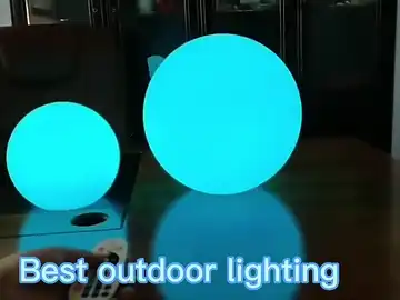 Solar LED sphere cycling through purple blue green outdoor ambience