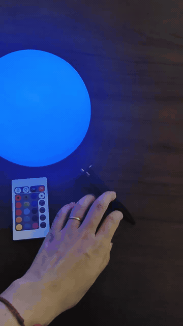 Solar LED ball lamp cycling through blue green red purple colours with remote