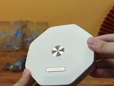 Folding origami lamp opening and rotating with warm light