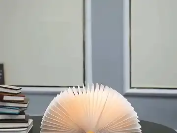 LumiLiving Folding Book Lamp - Lamp glowing warmly, enhancing living space
