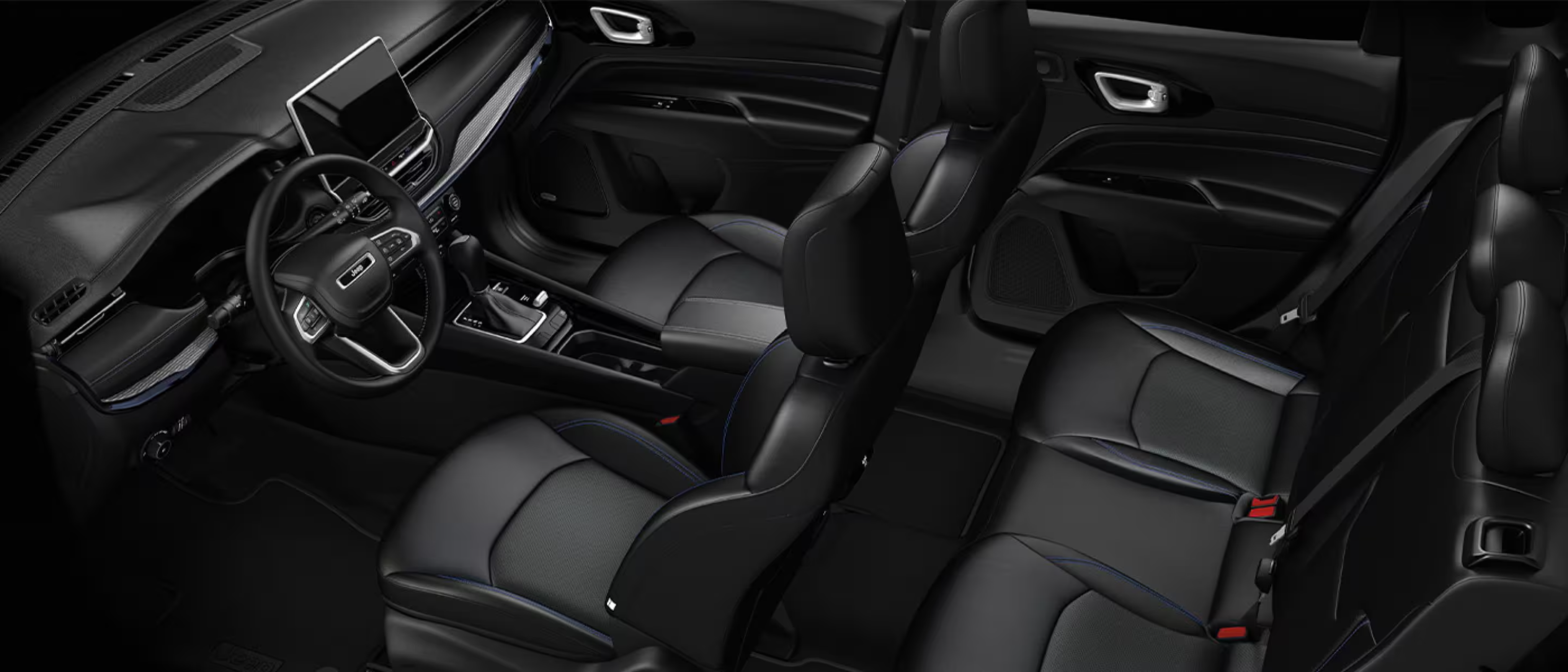 Black leather car seats and a steering wheel in a car interior.