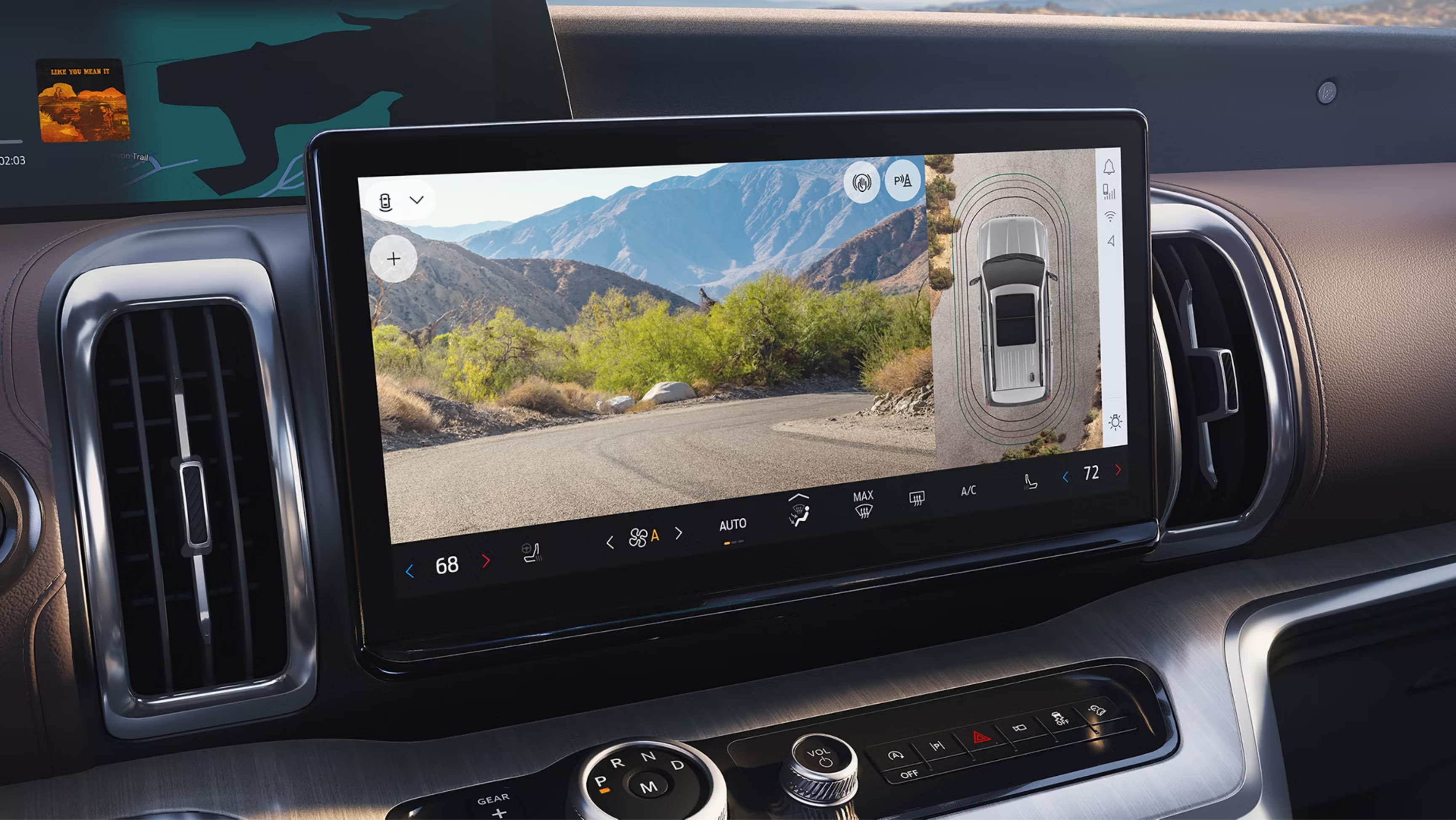 Dashboard displaying a scenic mountain road on touchscreen with bird's-eye view of the vehicle.