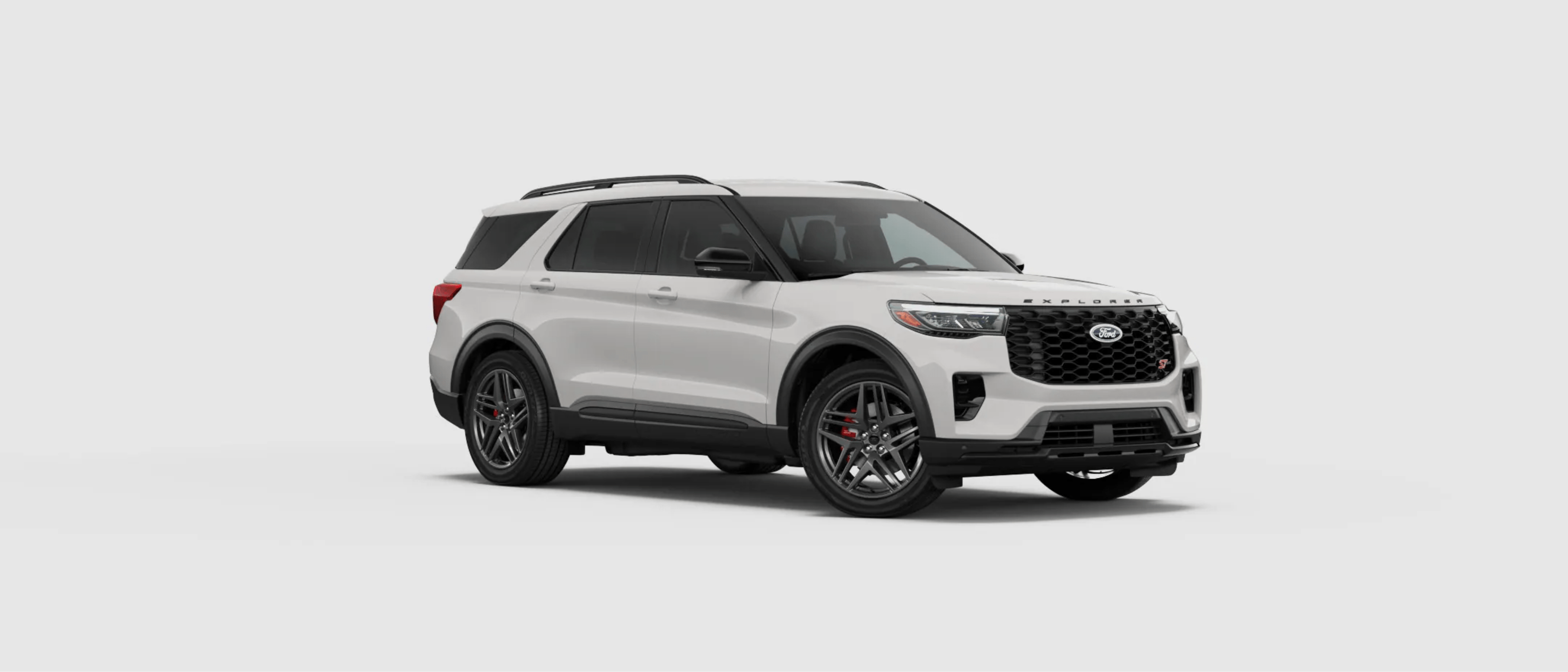 A white SUV is positioned in the center of a plain, light gray background.