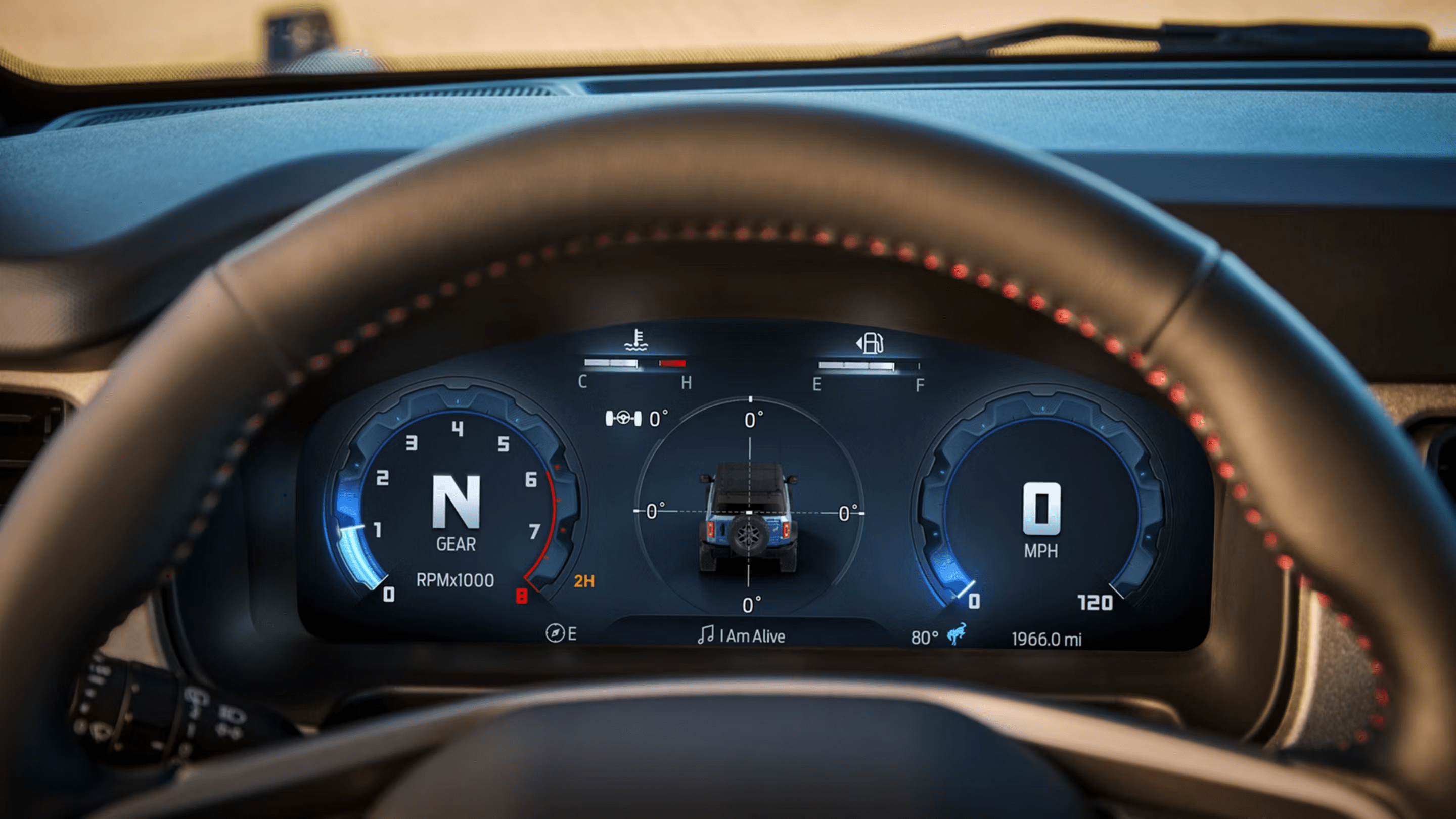 A leather-wrapped steering wheel frames a digital instrument cluster displaying vehicle telemetry, with a blurred dashboard and windshield in the background.