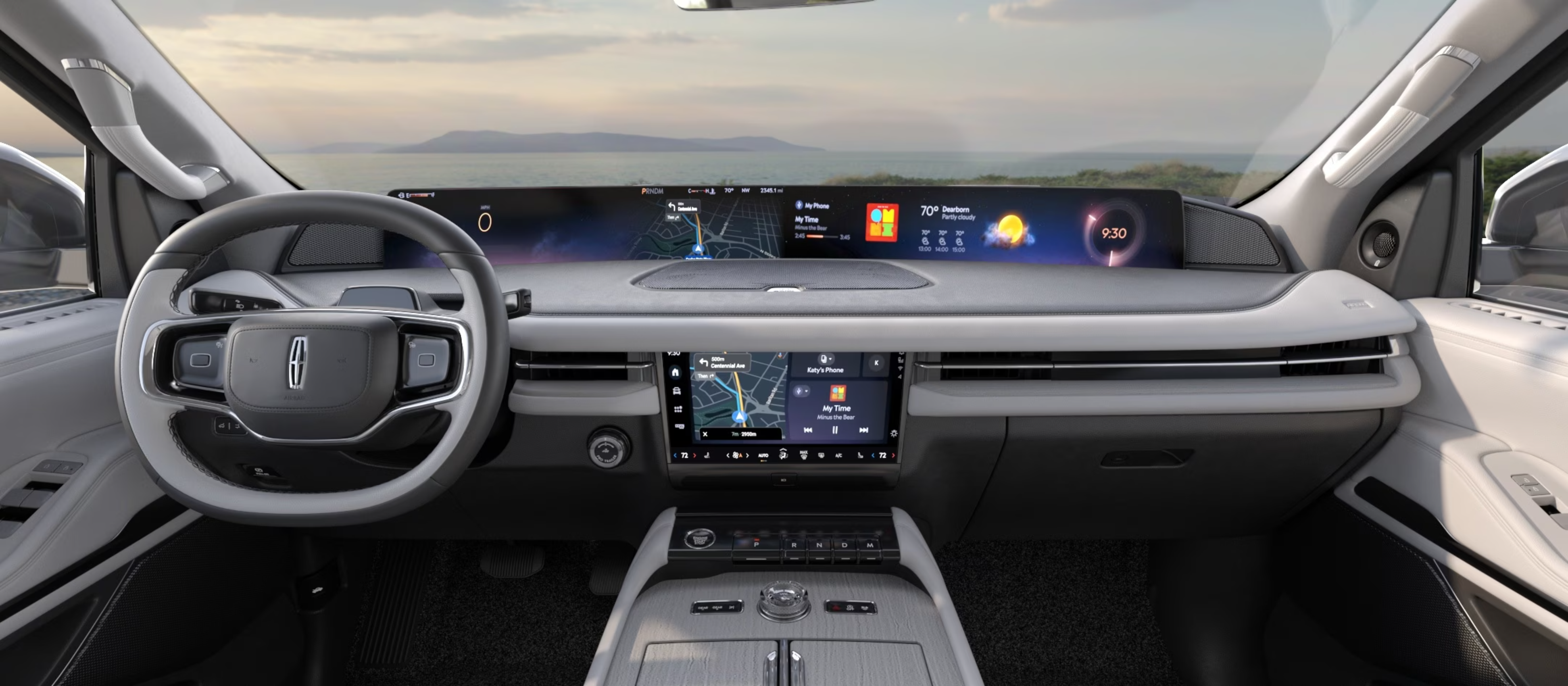 A modern car interior with a large digital dashboard and a scenic landscape visible through the windshield.